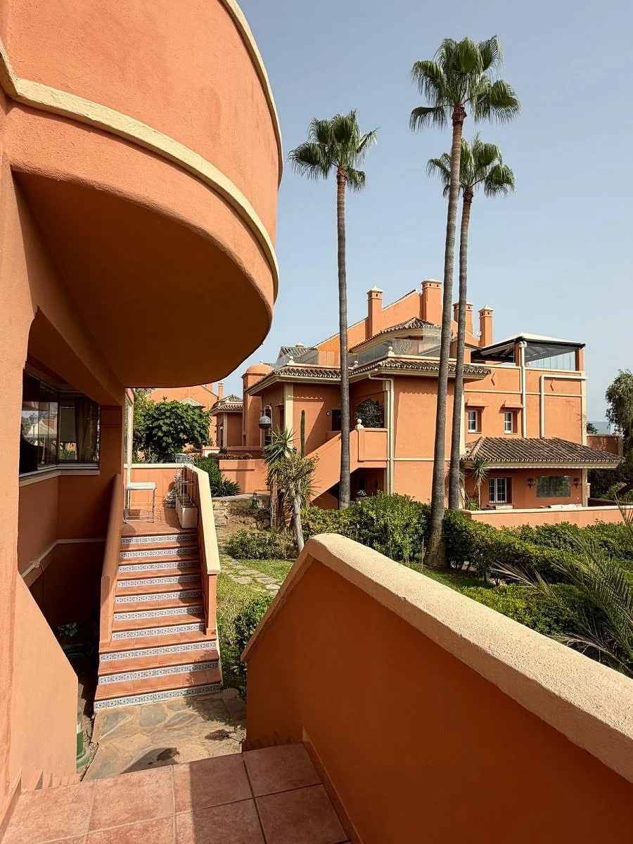 Elegant ground-floor 2-bedroom apartment with large terrace and direct access to communal gardens & pool