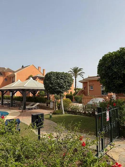 Elegant ground-floor 2-bedroom apartment with large terrace and direct access to communal gardens & pool · 2/16