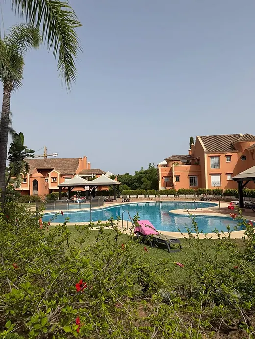 Elegant ground-floor 2-bedroom apartment with large terrace and direct access to communal gardens & pool · 3/16