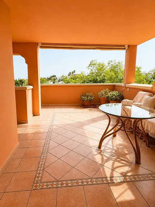 Elegant ground-floor 2-bedroom apartment with large terrace and direct access to communal gardens & pool · 4/16