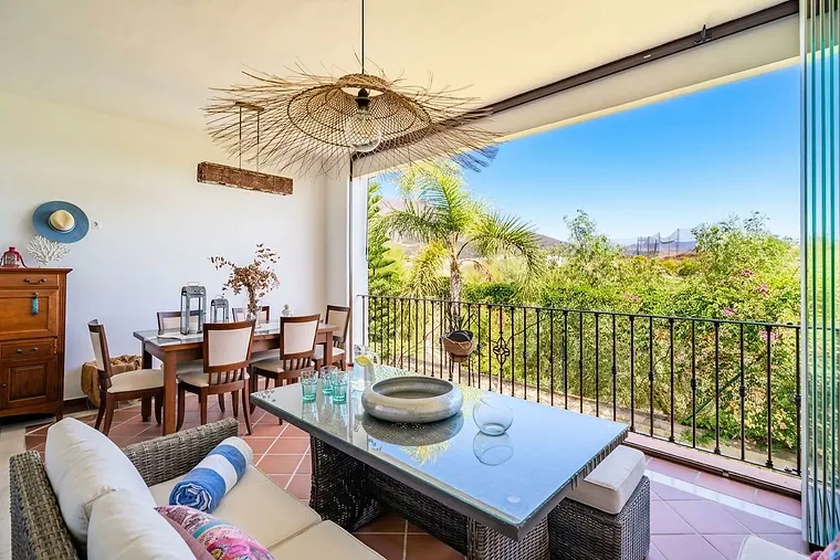 Townhouse opposite Santa María Golf with spacious east-facing terrace and golf, sea, and mountain views